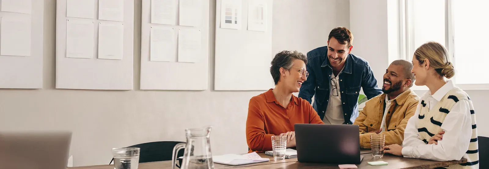 A group of people are having a meeting in a conference room.