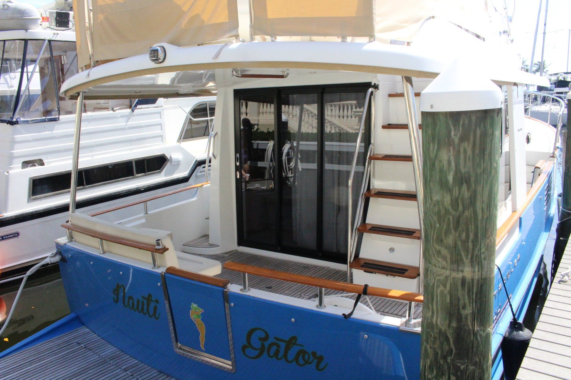 A boat named gator is docked at a marina