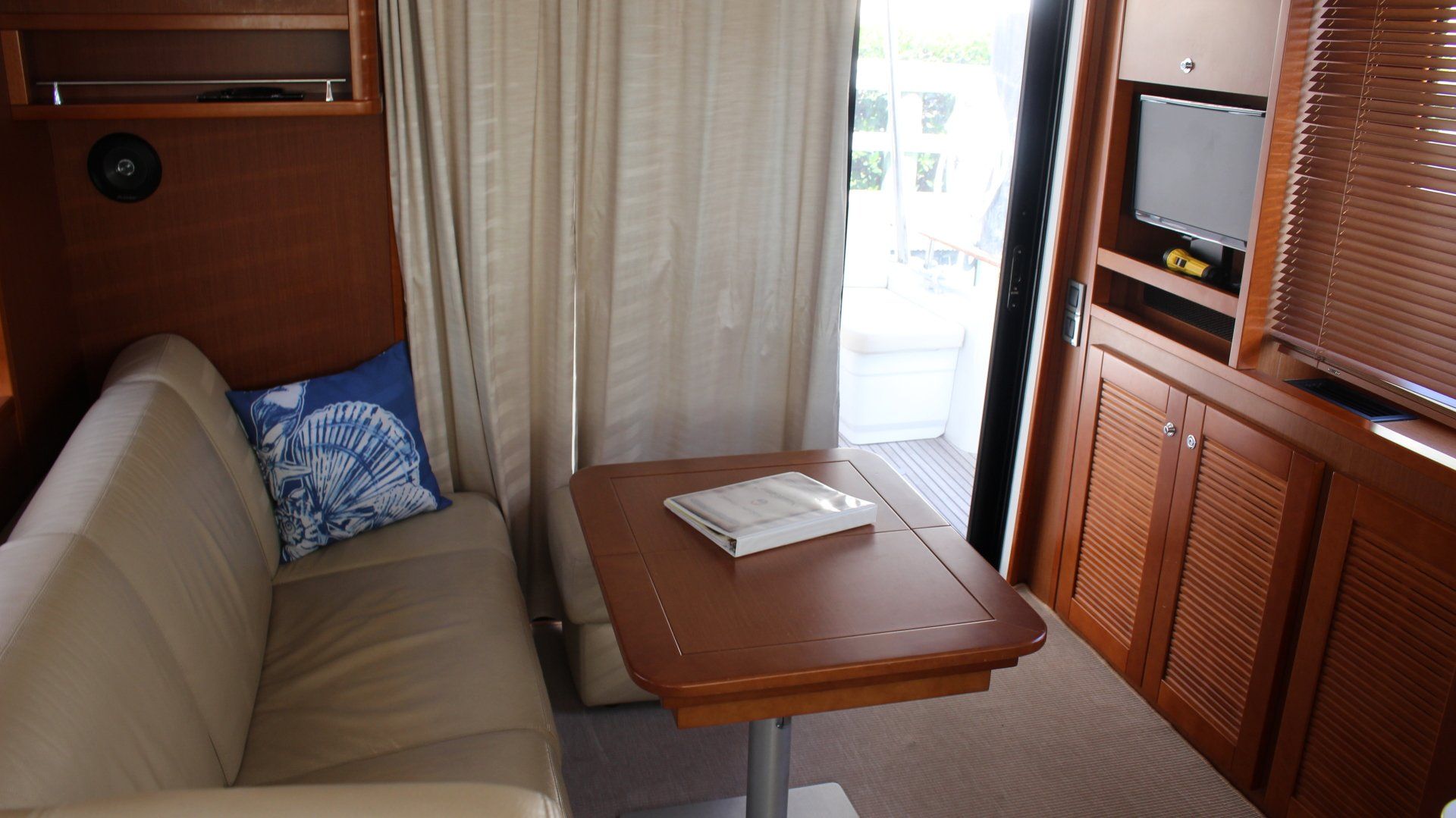 A living room with a couch a table and a television