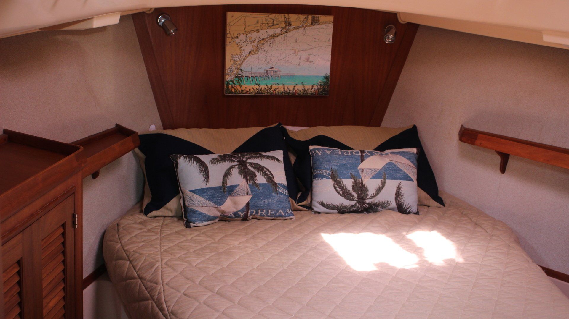 A bed with a map on the wall above it