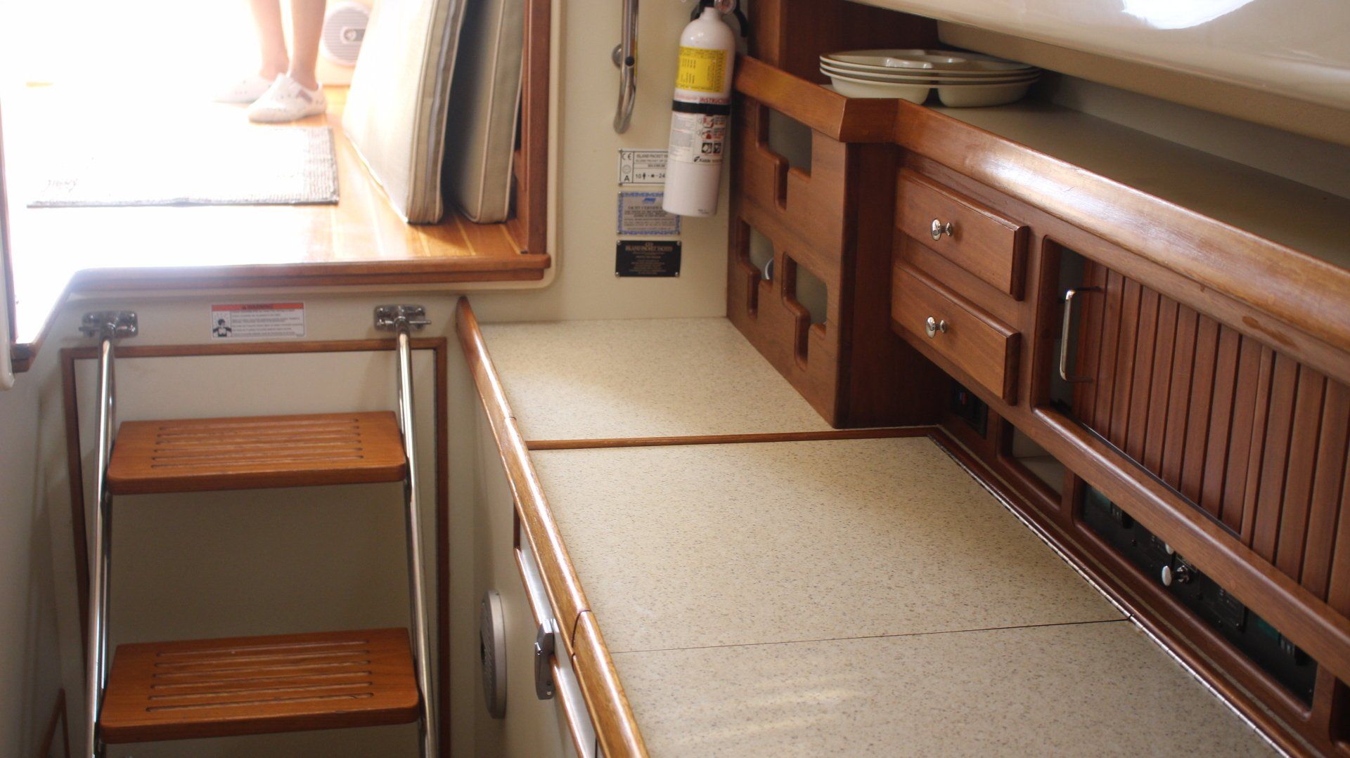 A boat with a fire extinguisher on the counter