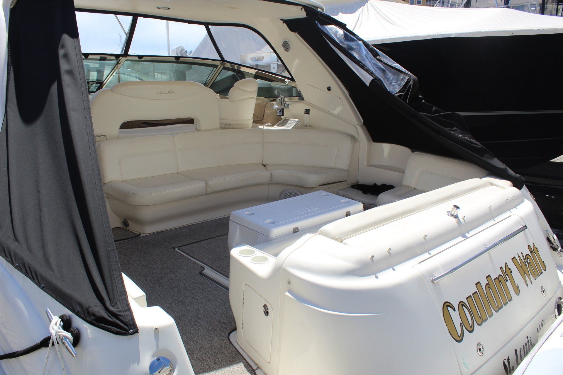 The back of a white boat with the name comfort net on it