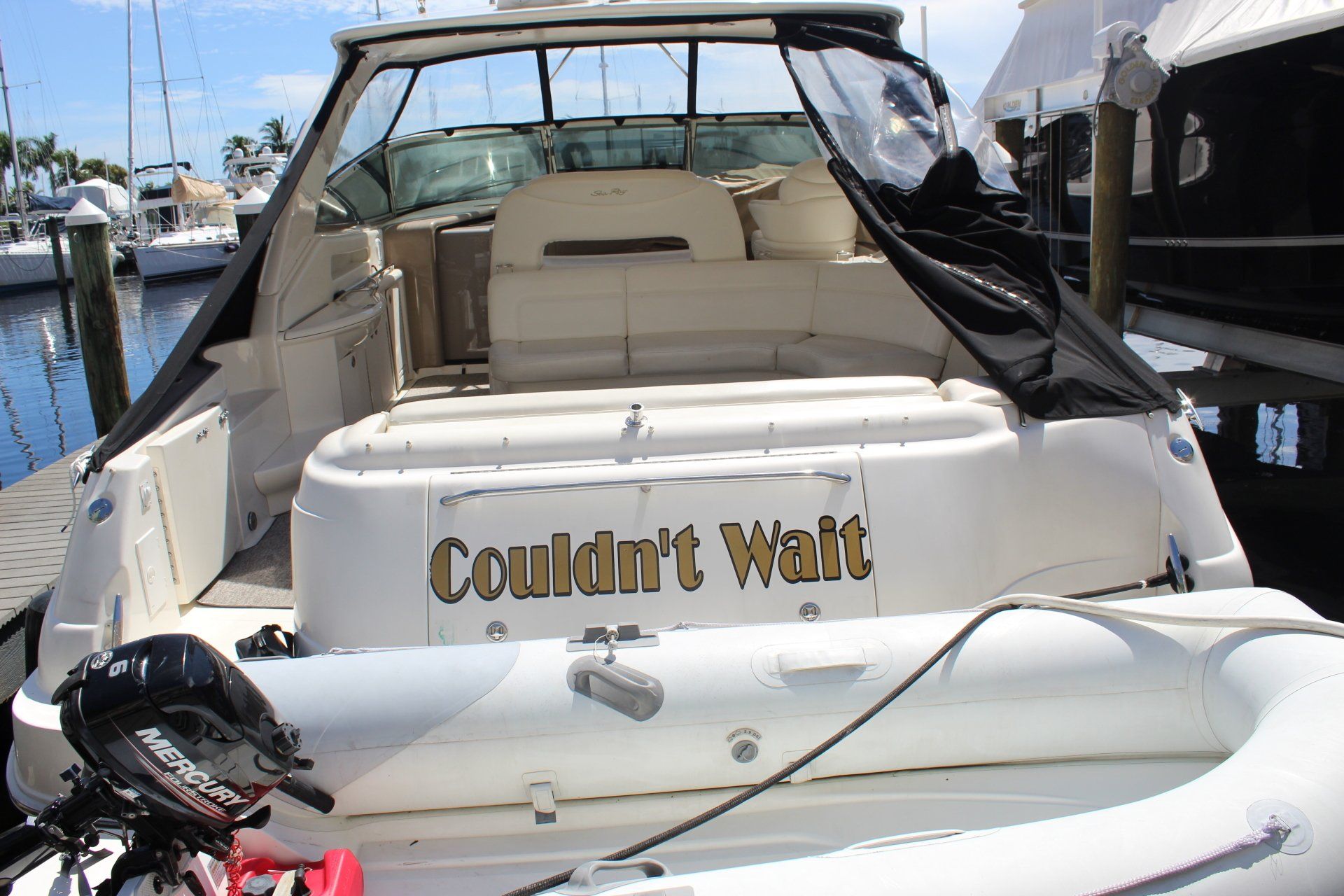 A boat that says couldn 't wait on the back