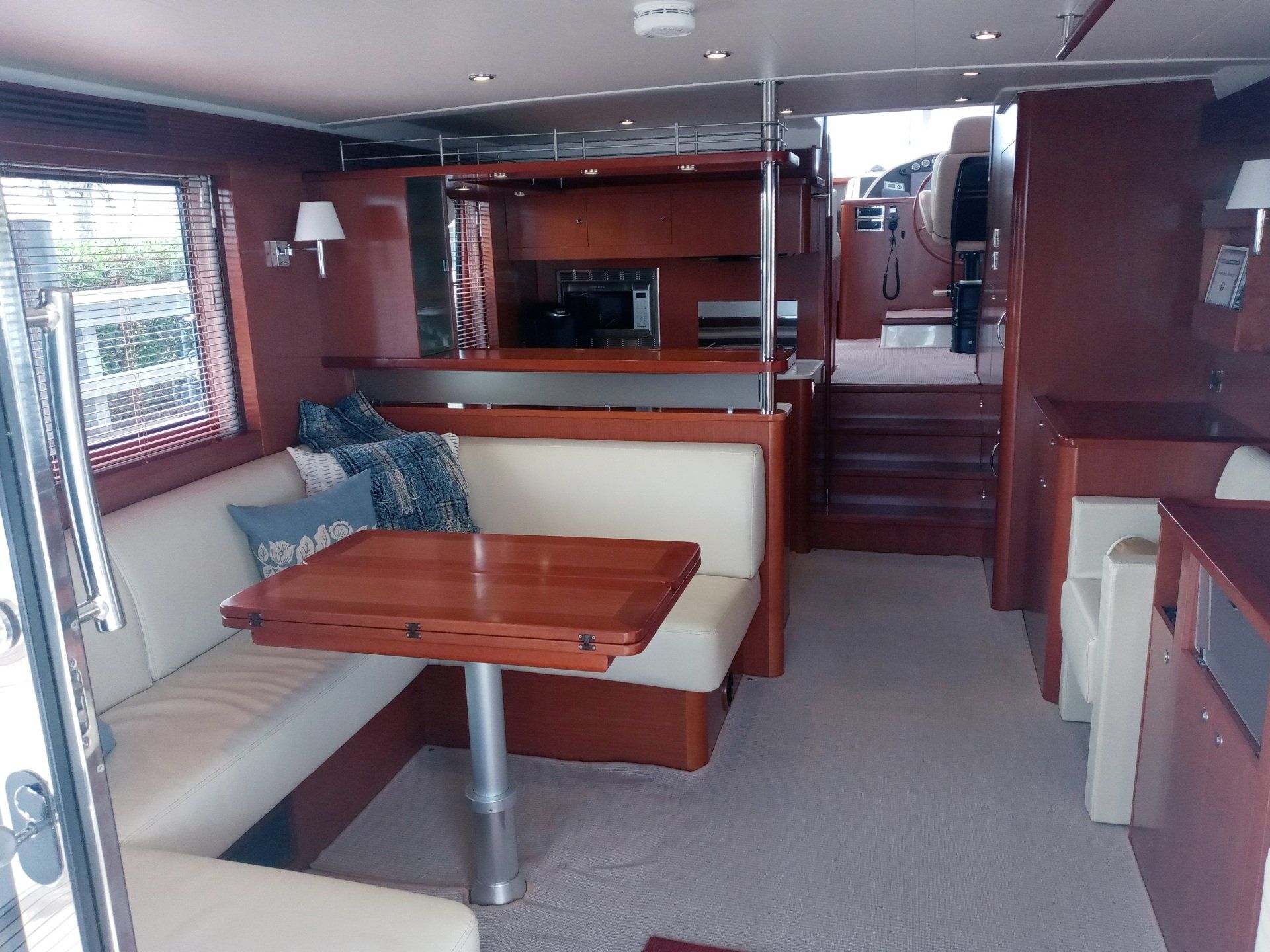 The inside of a boat with a table and a couch
