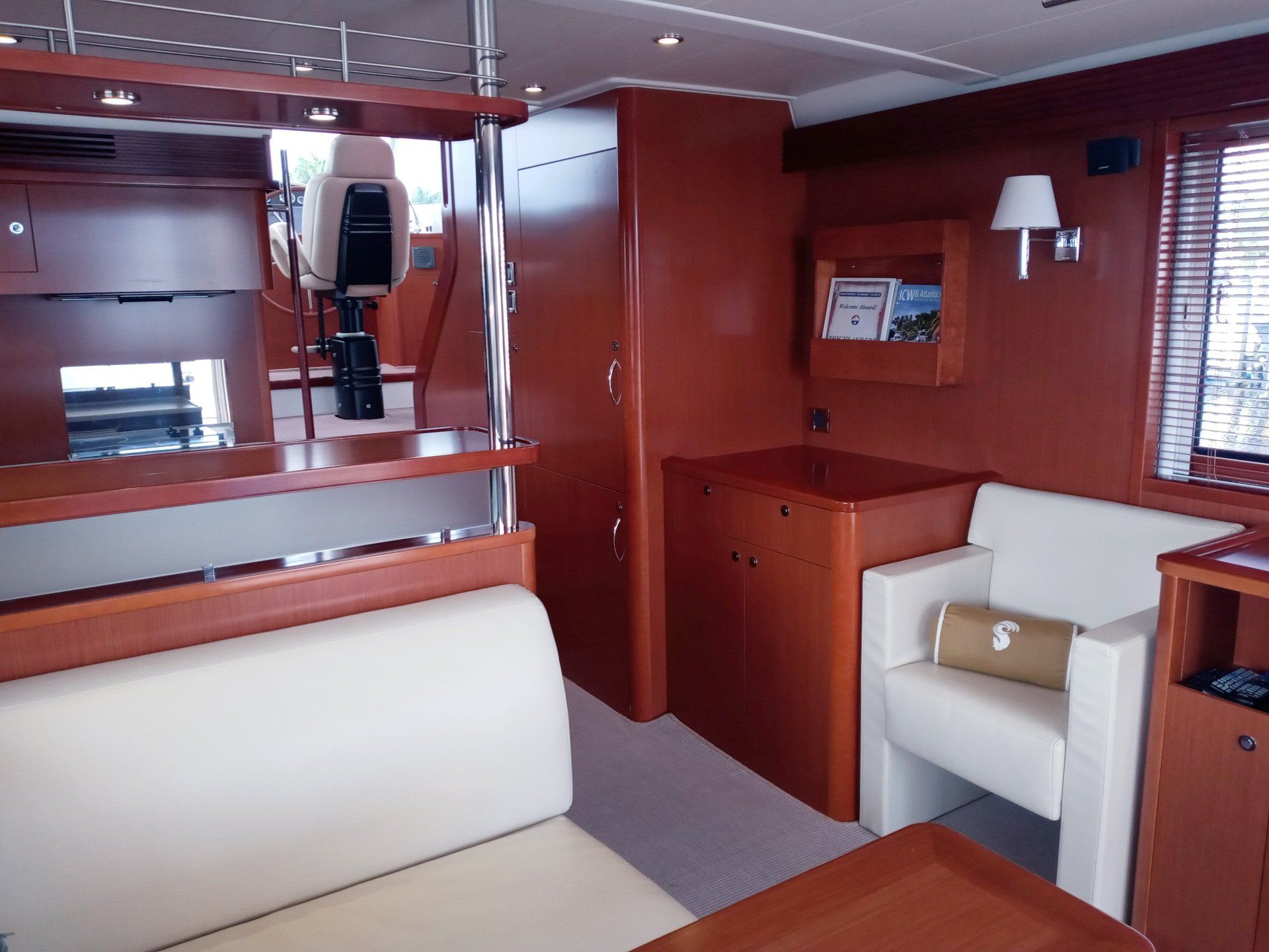 A living room on a boat with a couch and chair