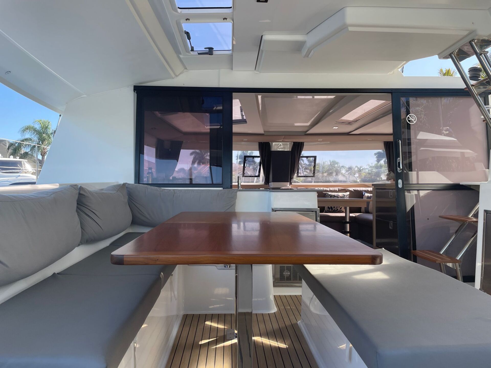 The inside of a boat with a table and benches