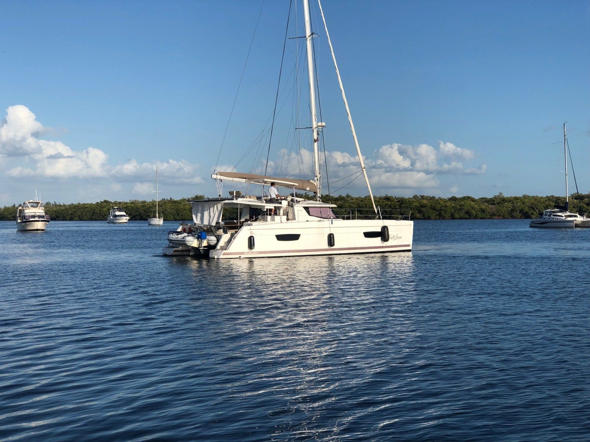 A sailboat is floating on top of a body of water.