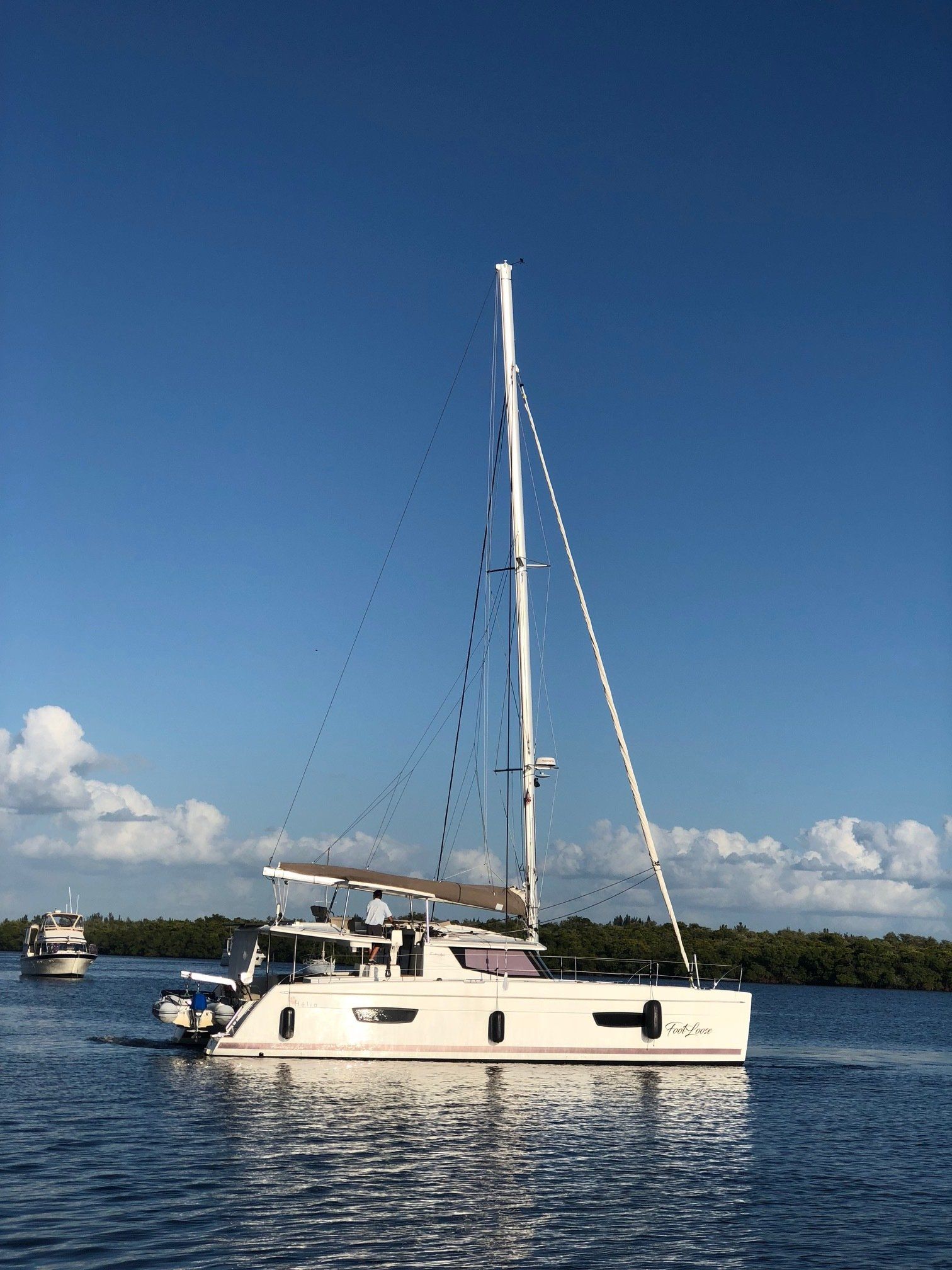 A sailboat is floating on top of a body of water.