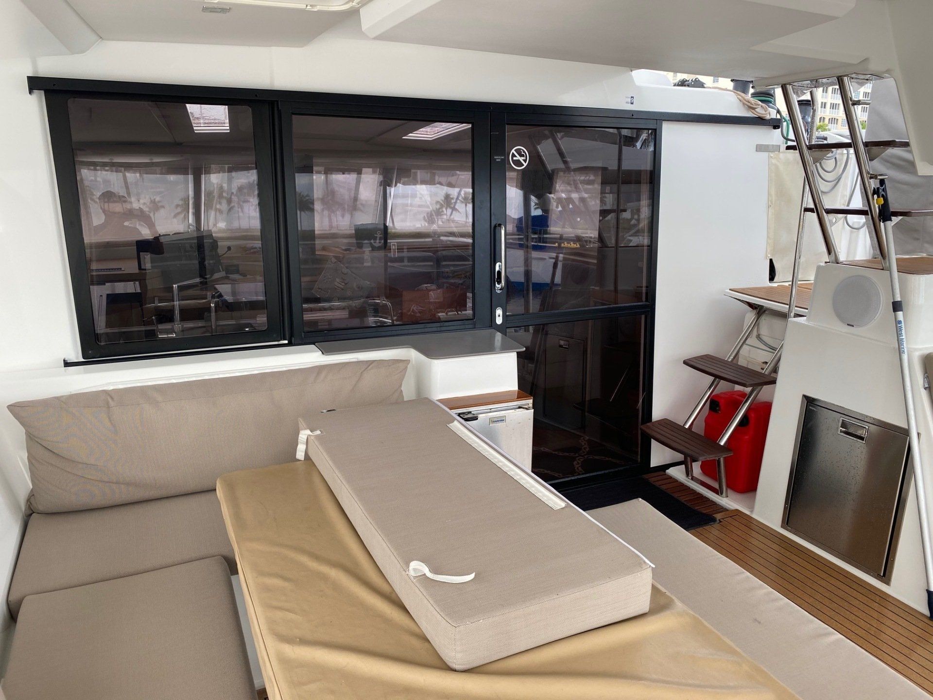 A living room on a boat with a couch and a table.