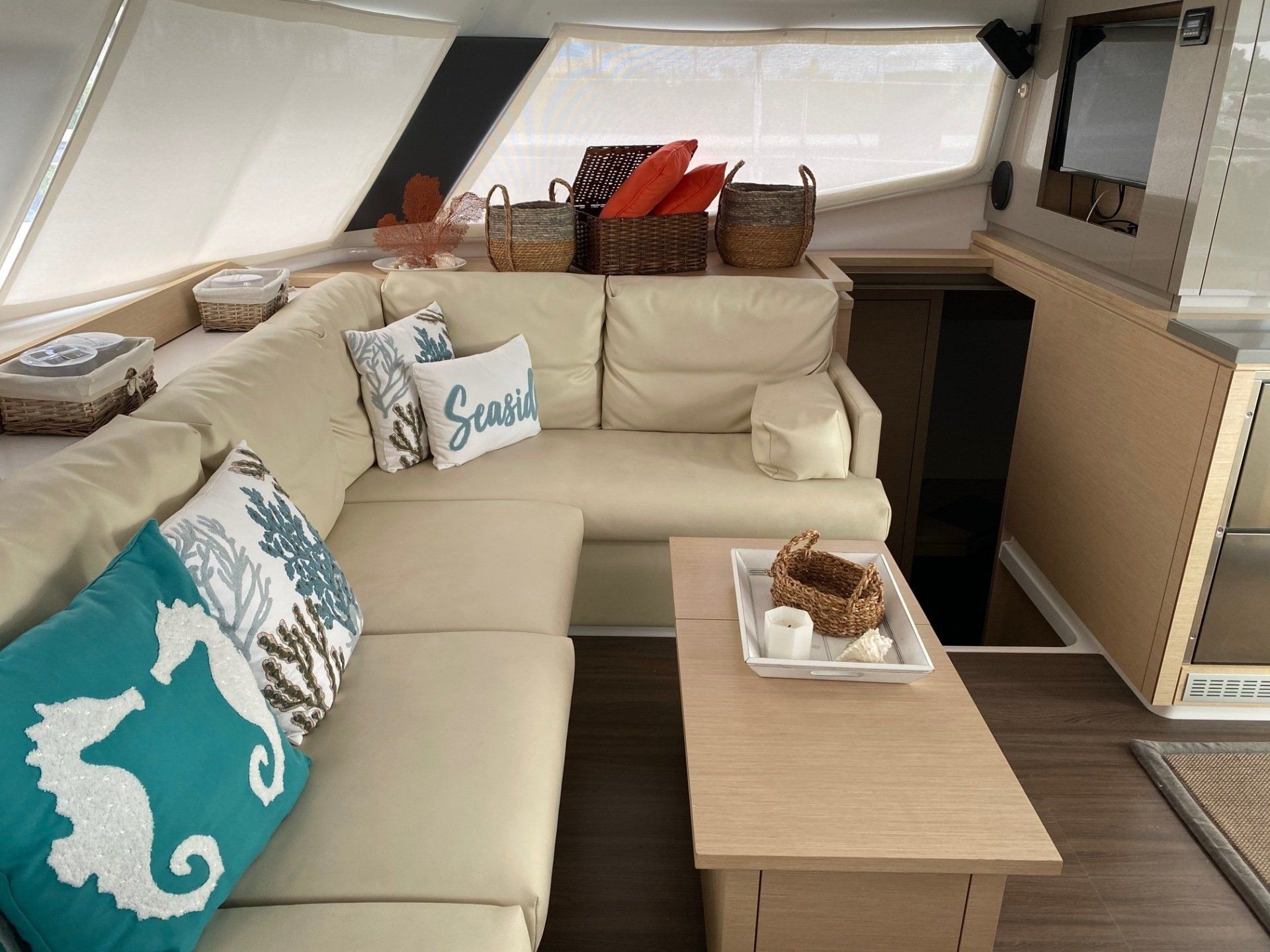 A living room on a boat with a couch and a coffee table.