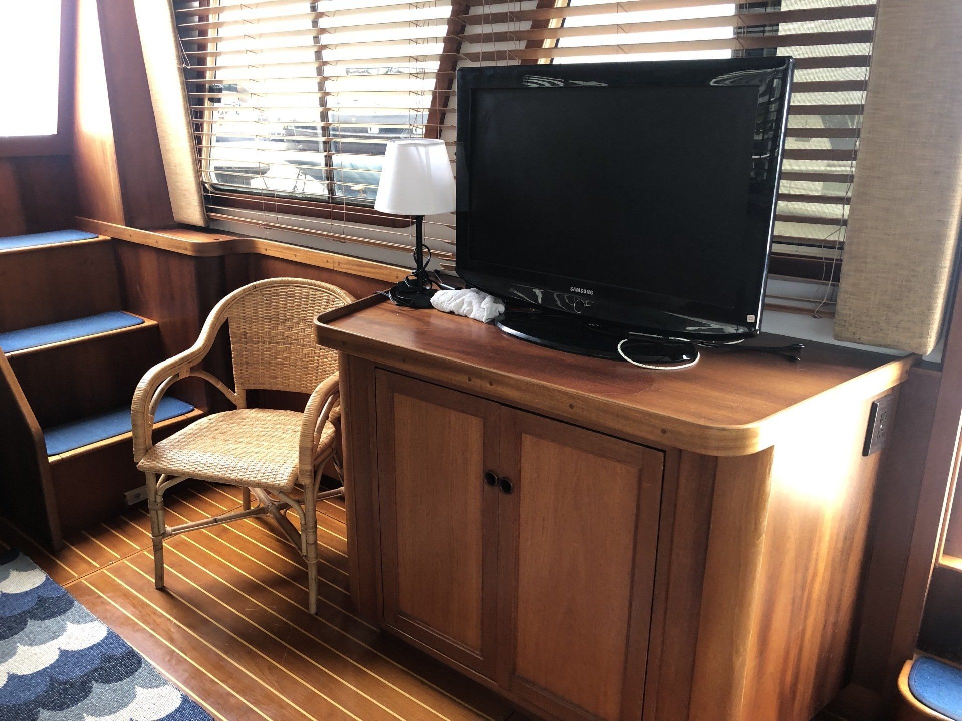 A wooden cabinet with a flat screen tv on top of it