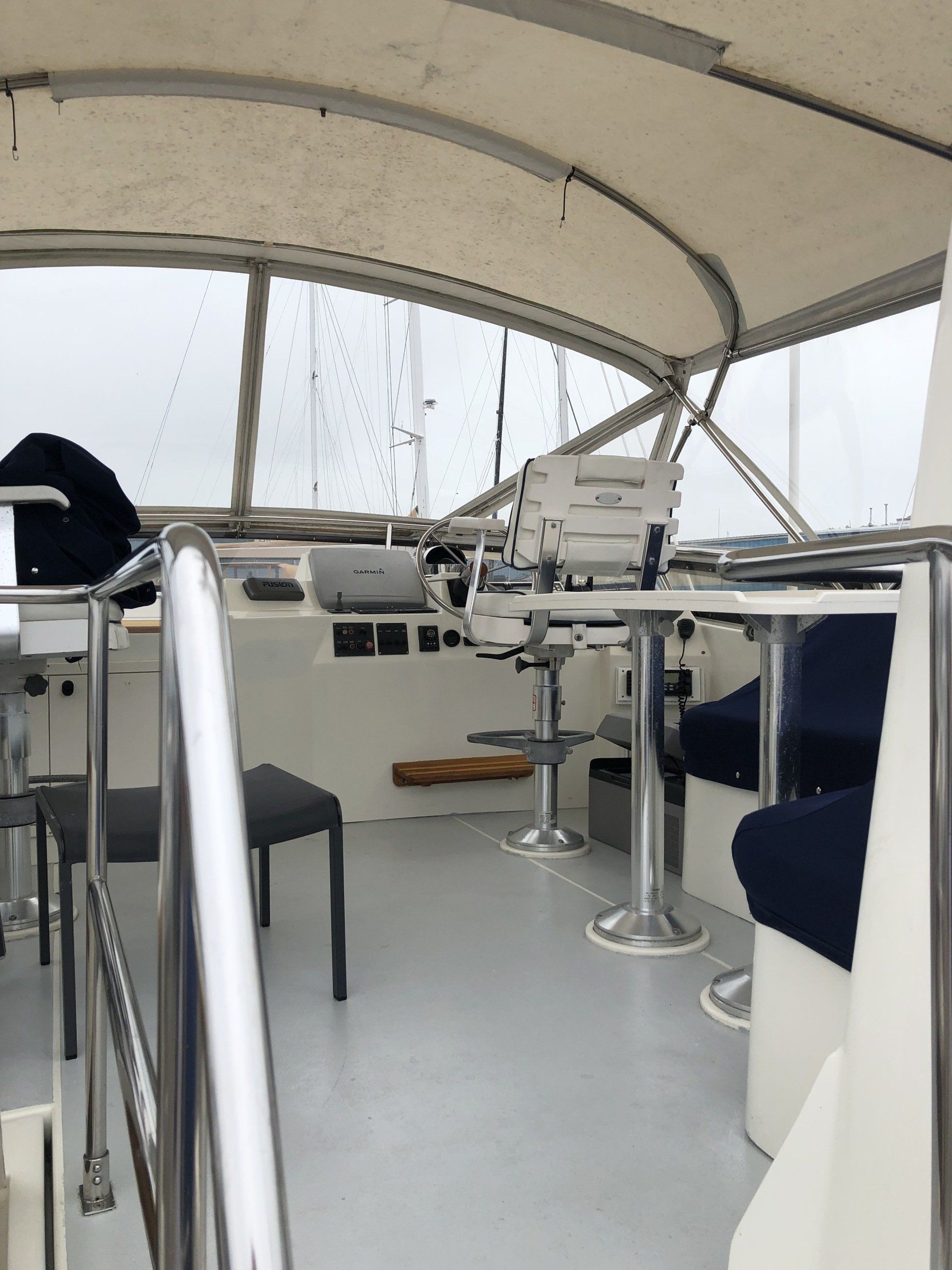 The inside of a boat with tables and chairs