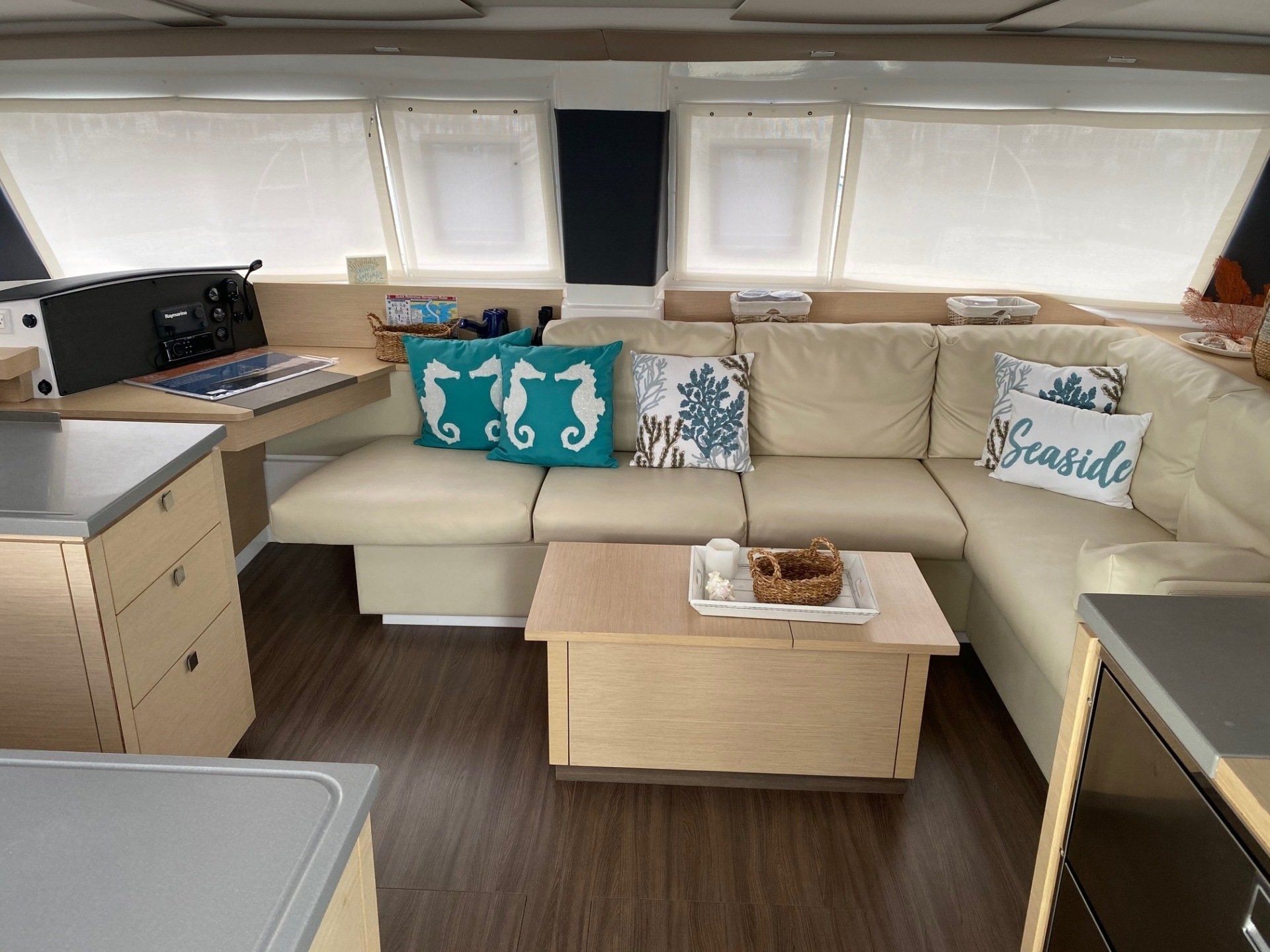 A living room on a boat with a couch and a coffee table