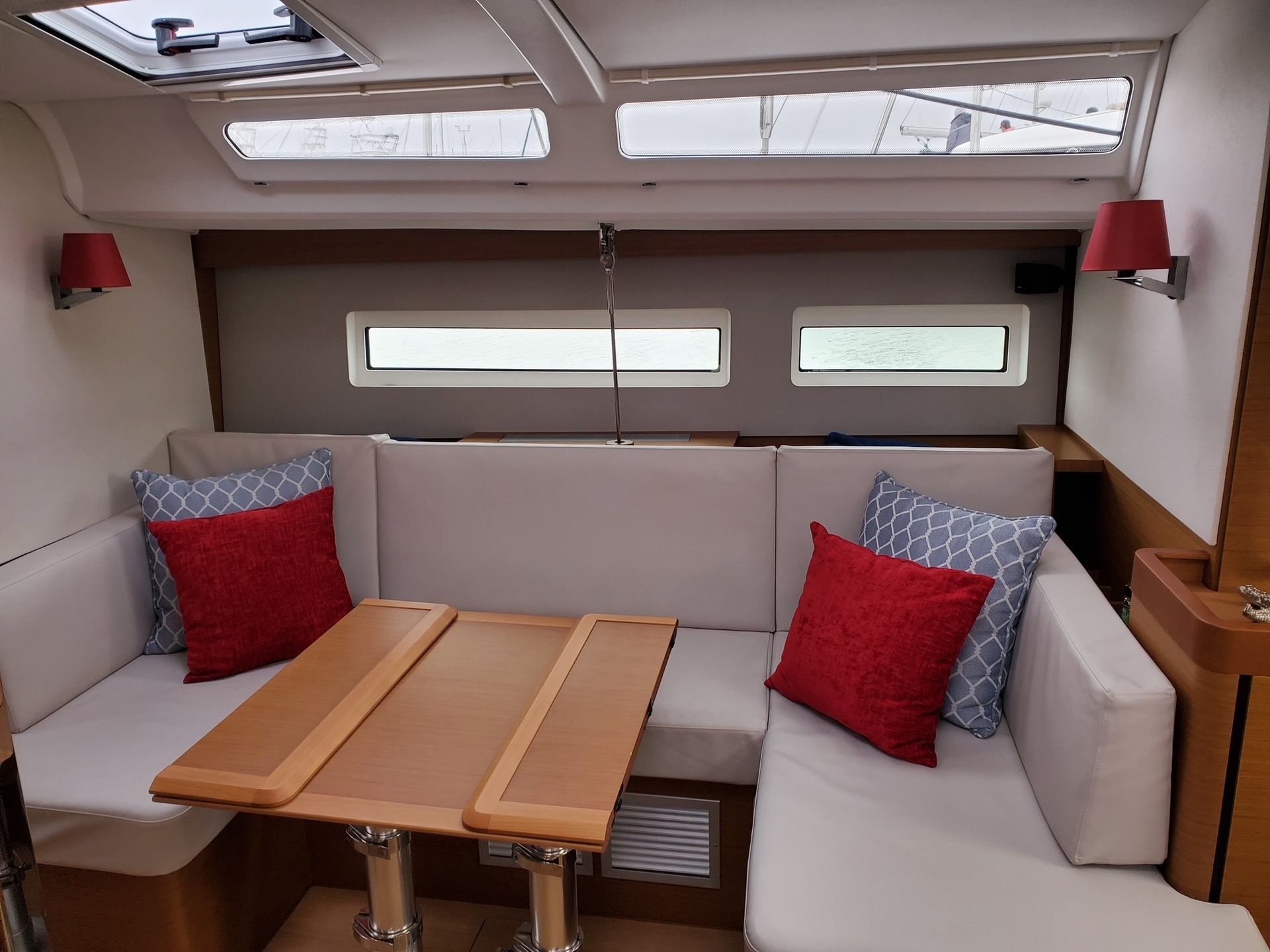 A living room on a boat with a table and couch