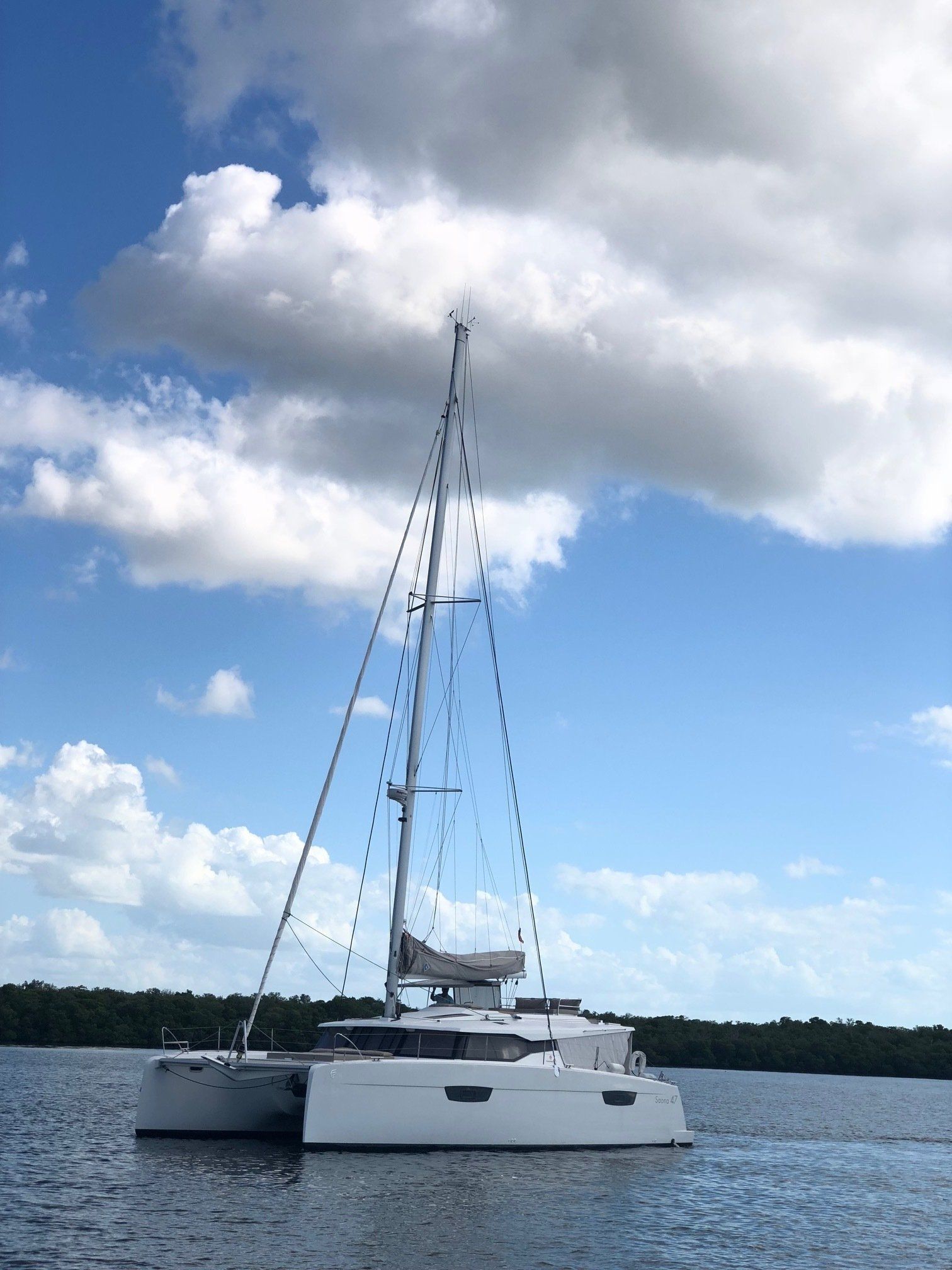 A sailboat is floating on top of a body of water.