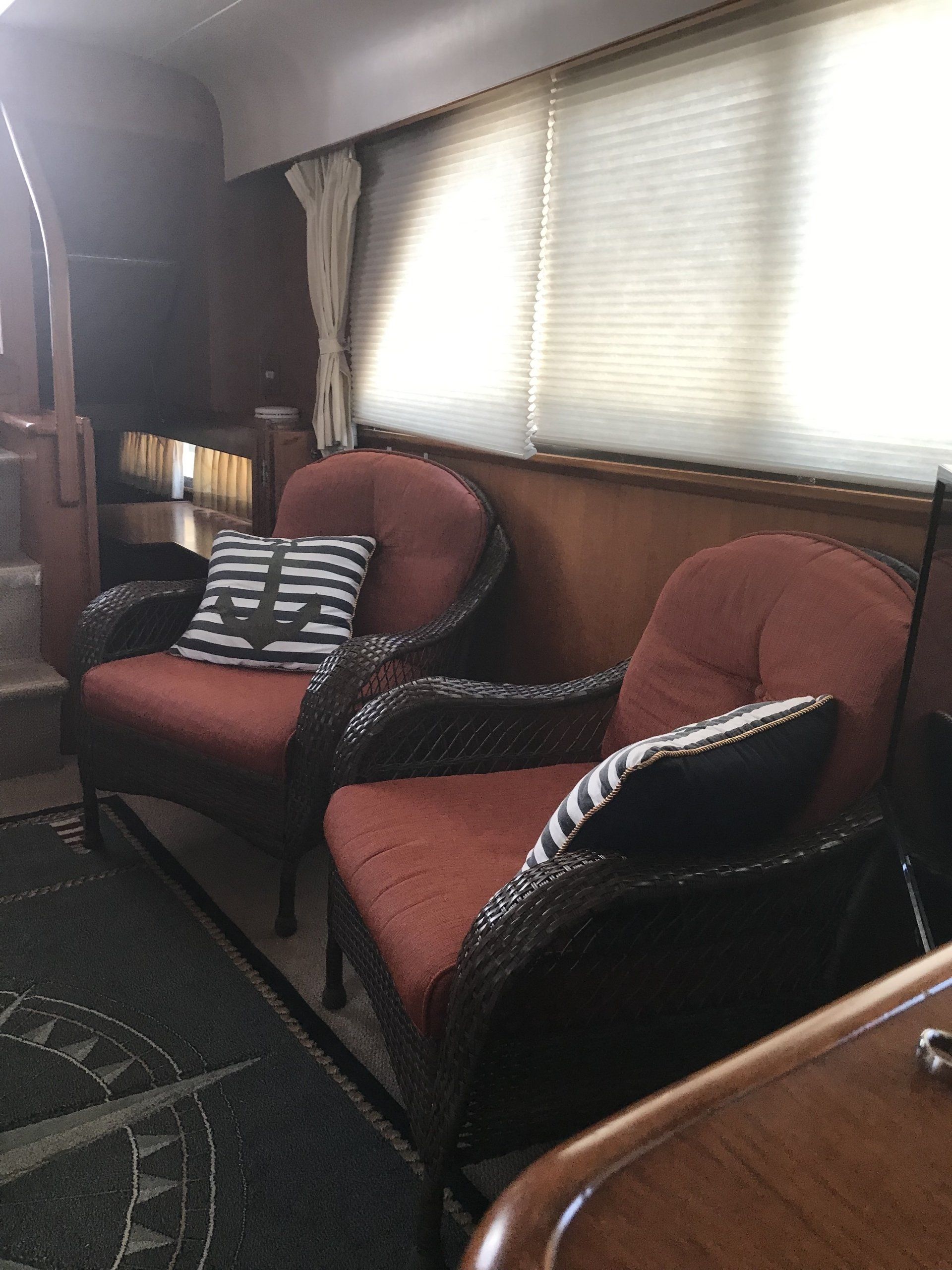 A living room with two chairs and a couch