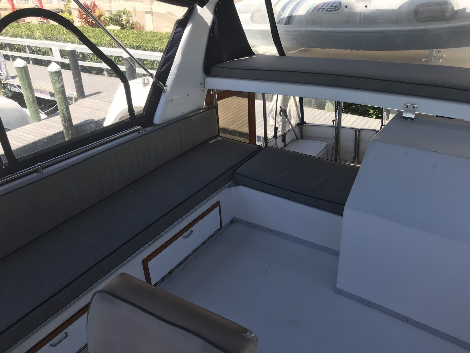 The inside of a boat with a couch and a table