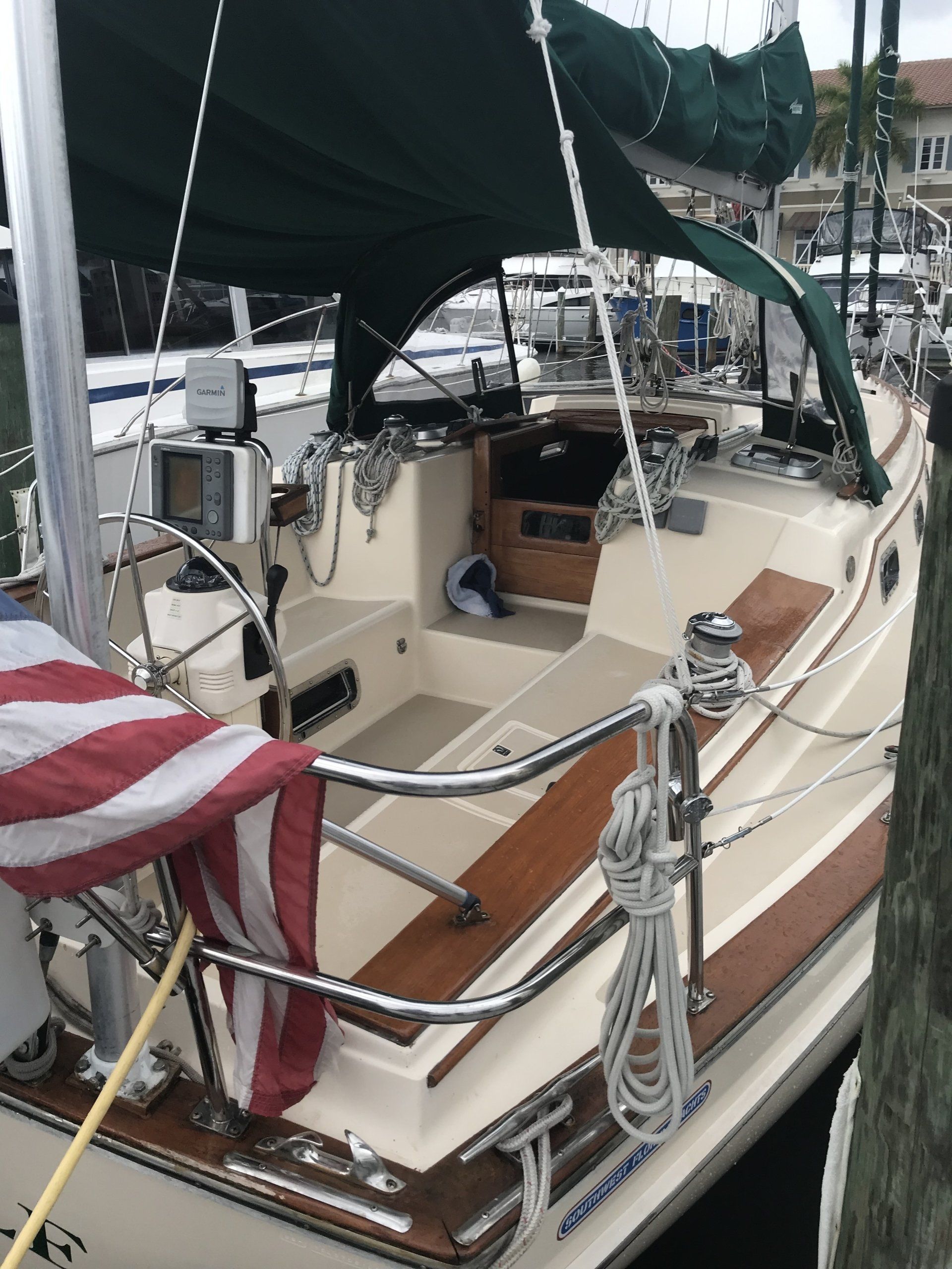 A sailboat with an american flag on the deck