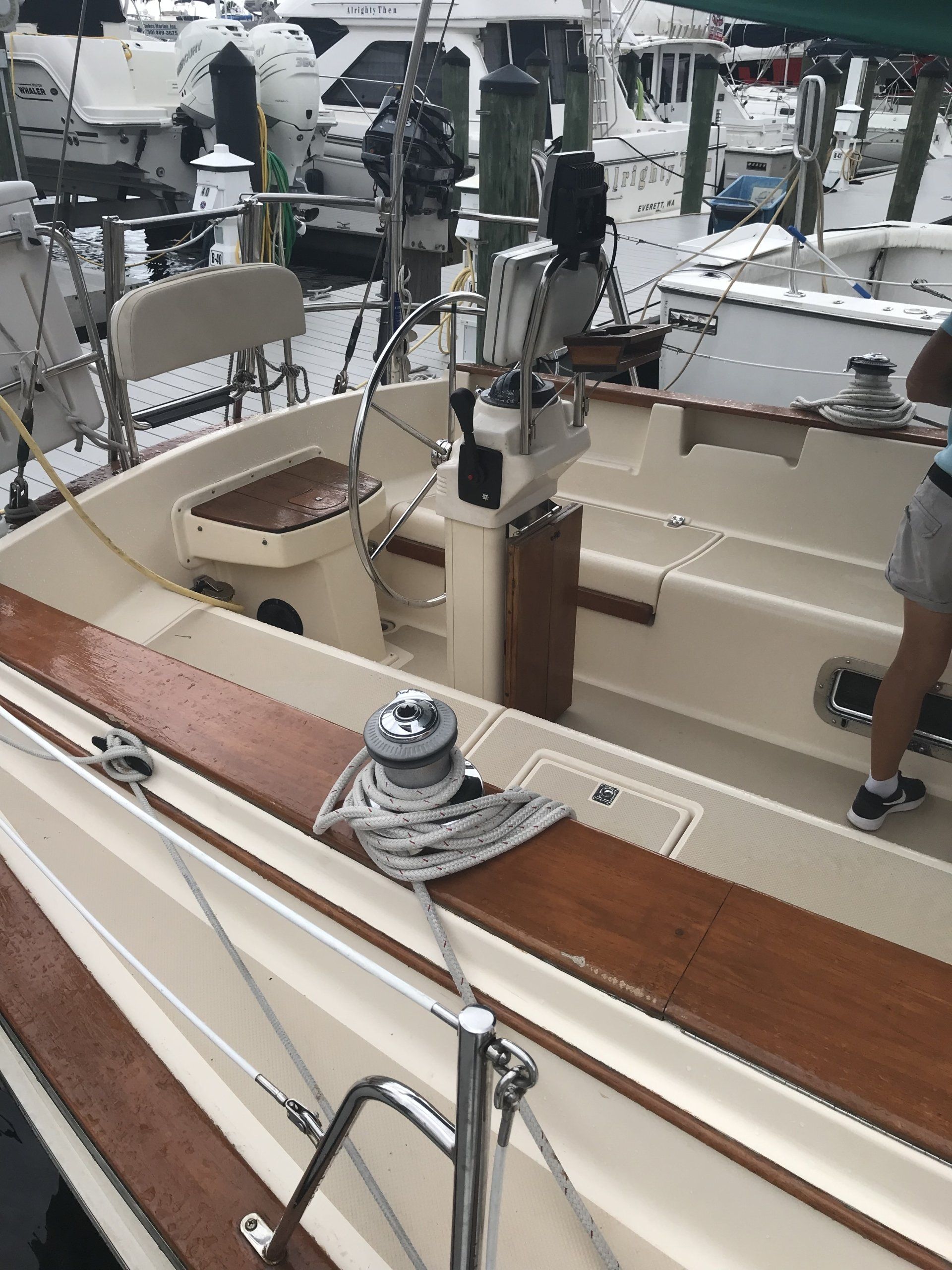 A person is standing on the deck of a boat.