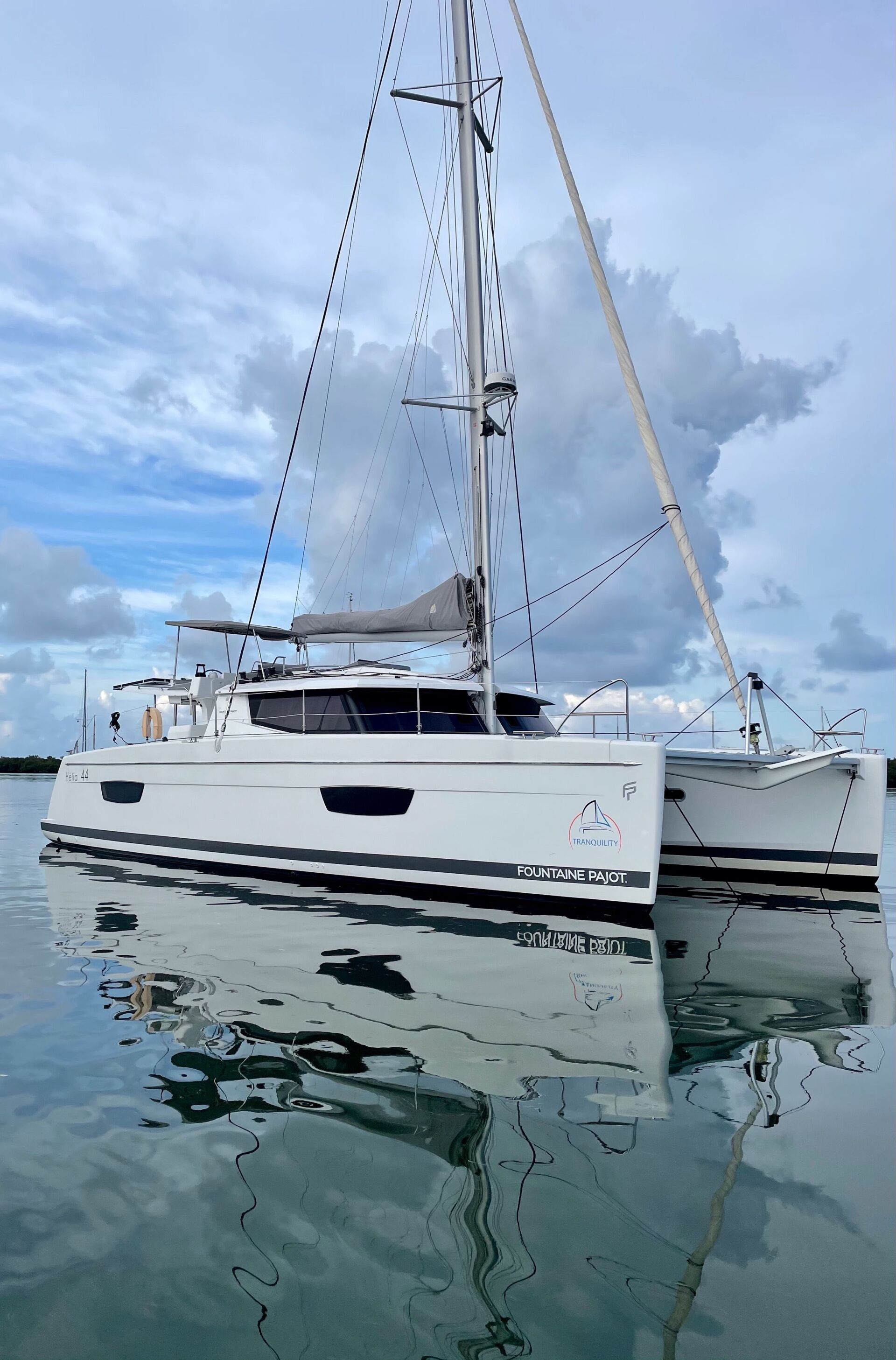 A sailboat is floating on top of a body of water.