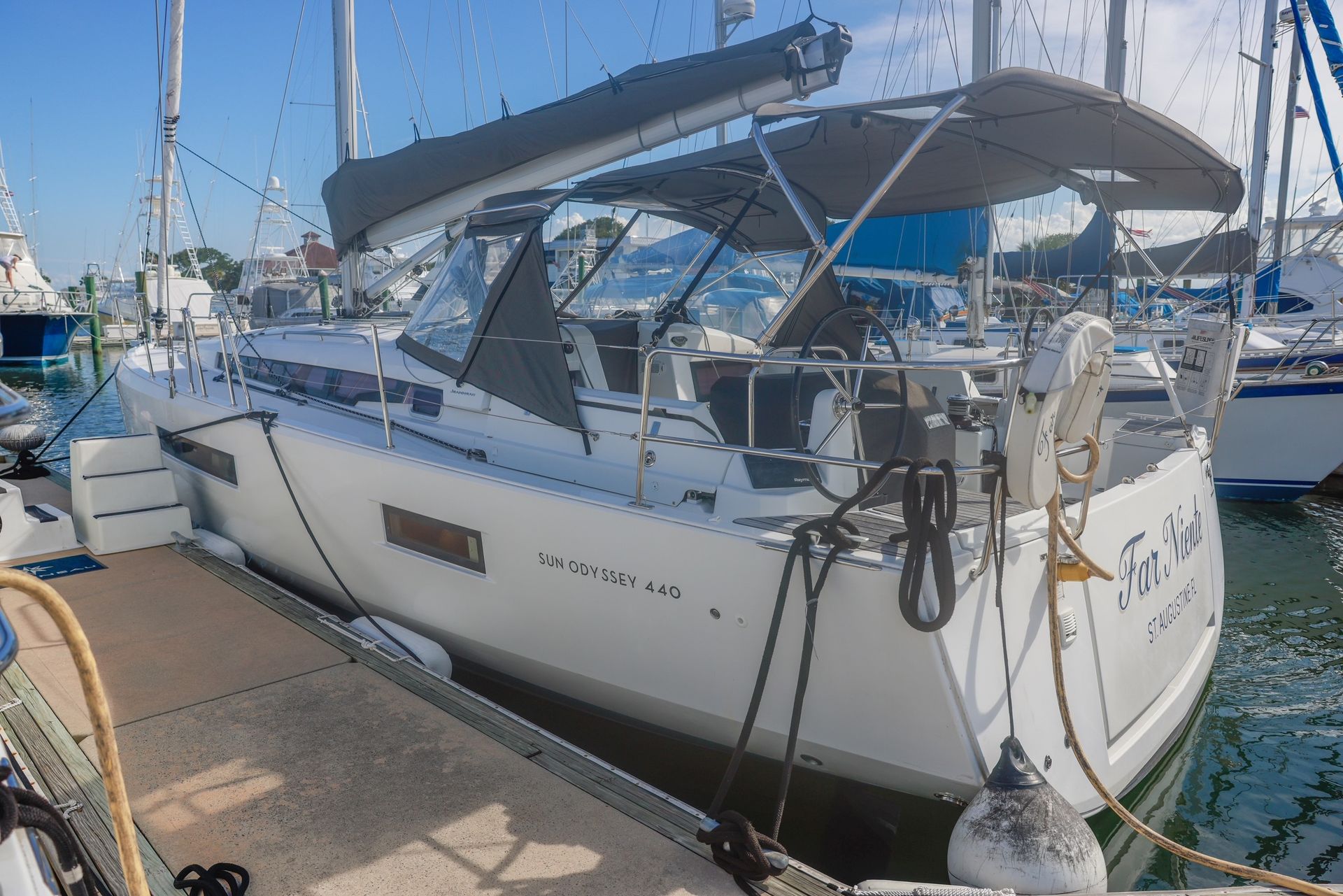 A sailboat is docked at a dock in a marina.