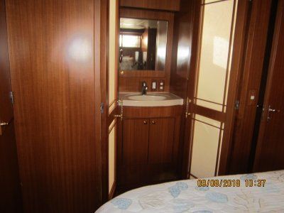 A bathroom with a sink and a mirror on the wall