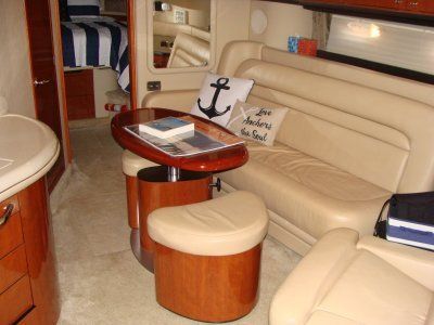 A couch with an anchor pillow on it