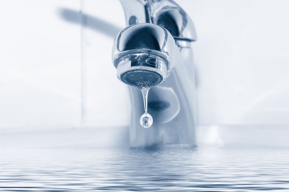 A Close Up Of A Water Faucet With A Drop Of Water Coming Out Of It — Bay City Plumbing in Sunshine Acres, QLD