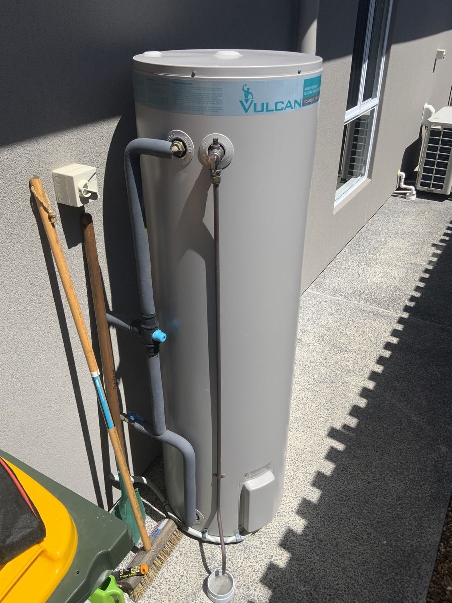 A Room With a Water Heater and Stairs in It — Bay City Plumbing in Sunshine Acres, QLD