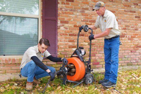 Sewer and Water Test — Plumbers Fixing a Sewer in Carrollton, TX