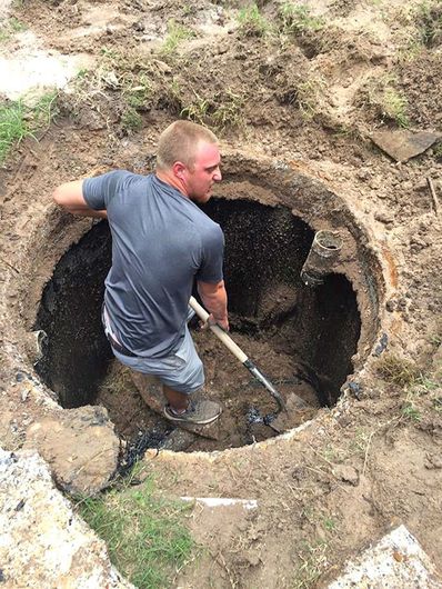 Worker Digging a Hole for Septic System