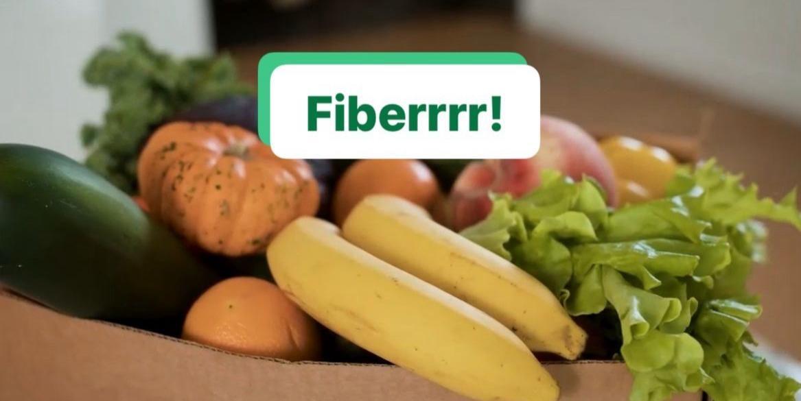 Fresh produce in a basket with a 