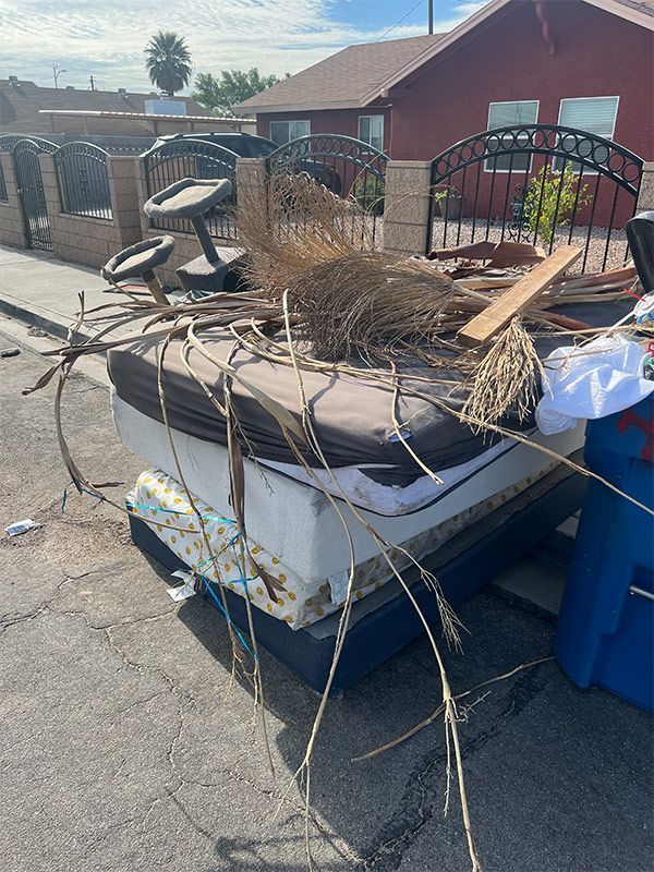 Large Trash Outside In The Fence — Las Vegas, NV — Junk Monster