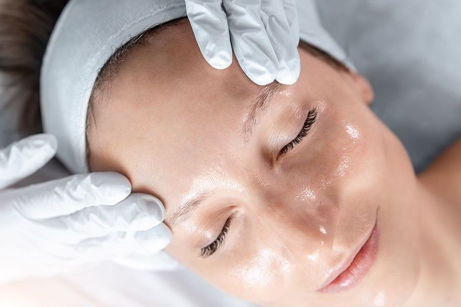 A Woman is Getting a Facial Treatment at a Beauty Salon — Organic Beauty by Kessie in Yeppoon, QLD