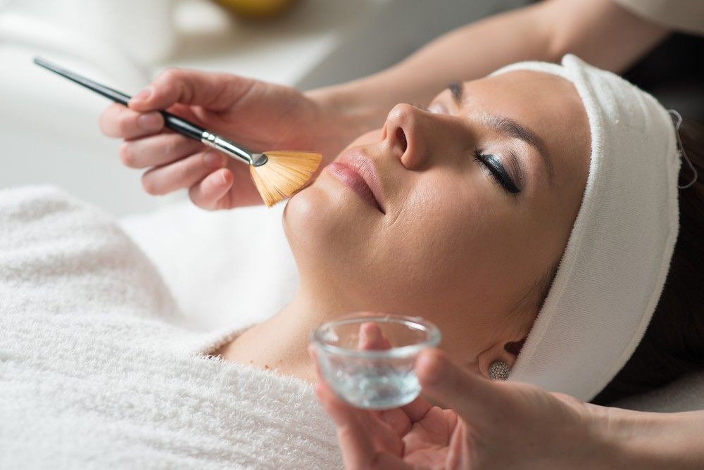 A Woman is Getting a Facial Treatment at a Spa — Organic Beauty by Kessie in Yeppoon, QLD