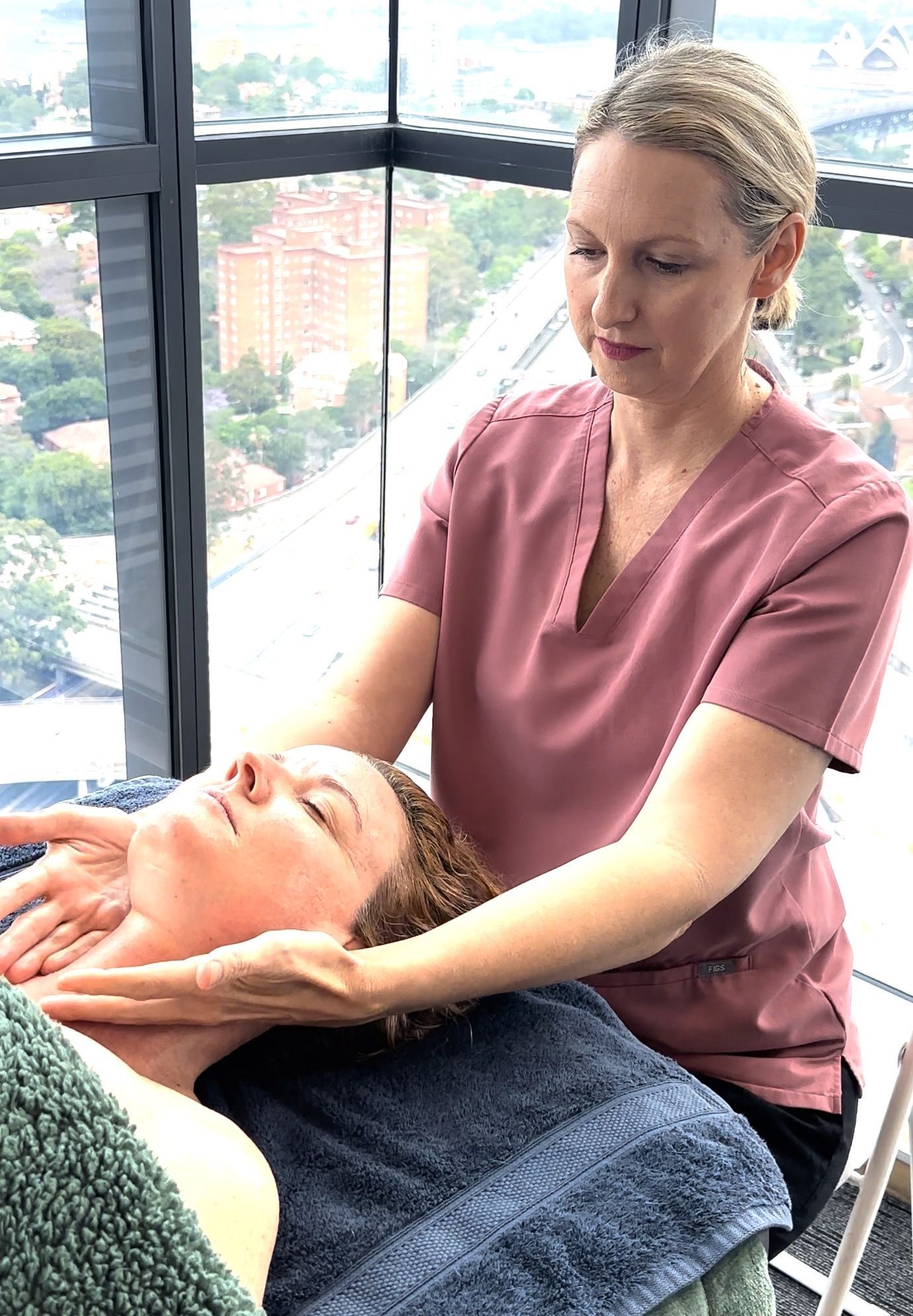 A Woman is Laying on a Bed Getting a Facial Treatment — Organic Beauty by Kessie in Yeppoon, QLD