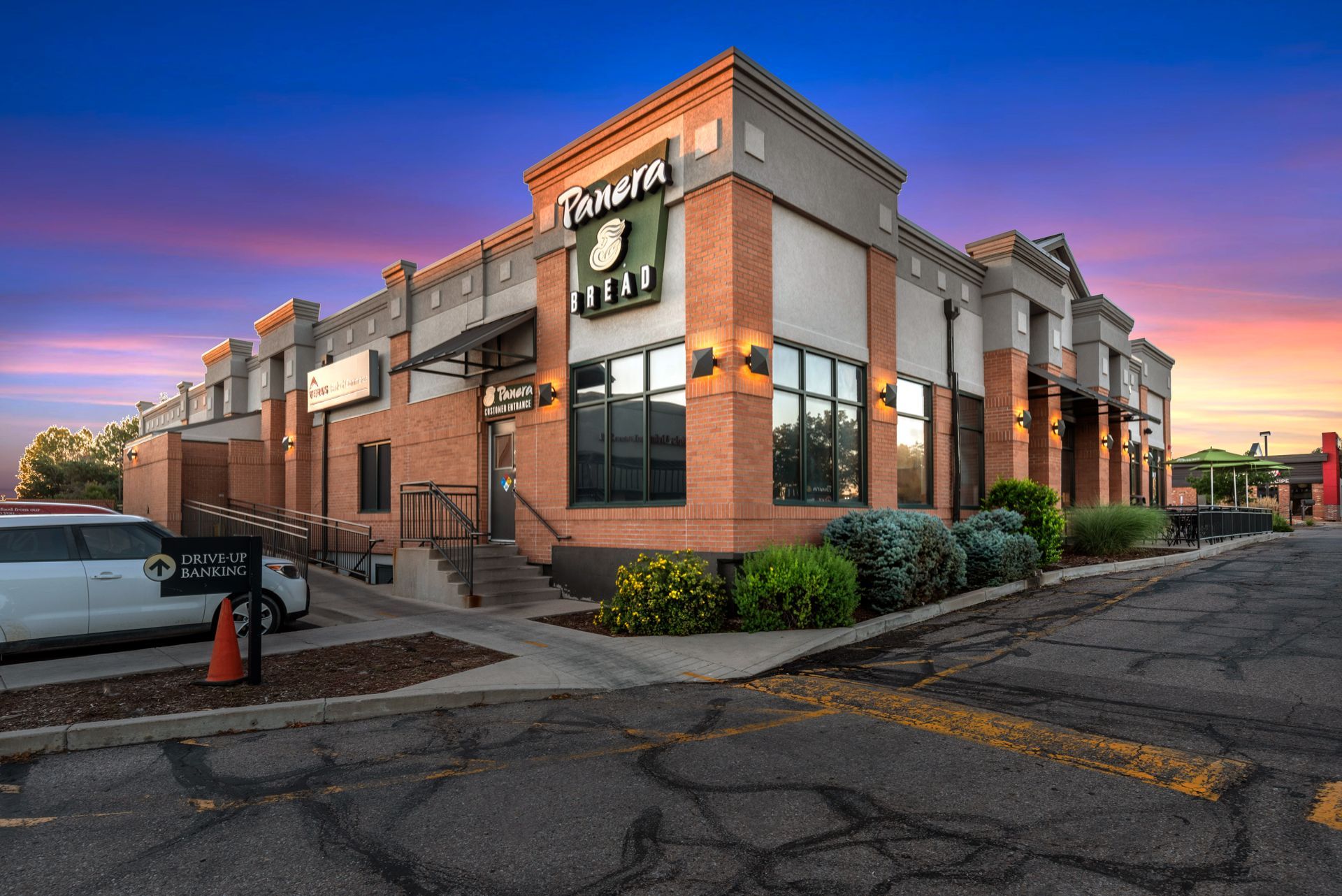 A store front with a yellow awning that says ' vins & liqueurs ' on it