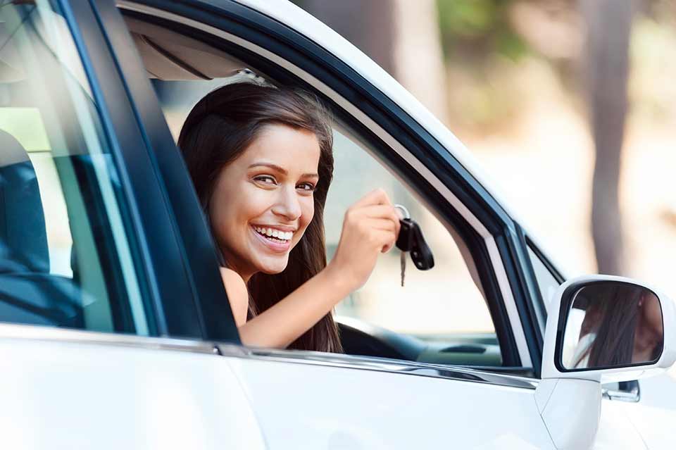 woman holding car keys