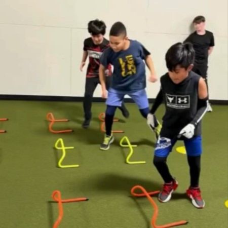 Young athletes performing speed and agility training