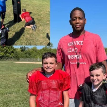 Coach Landon standing with young athletes after a private training session