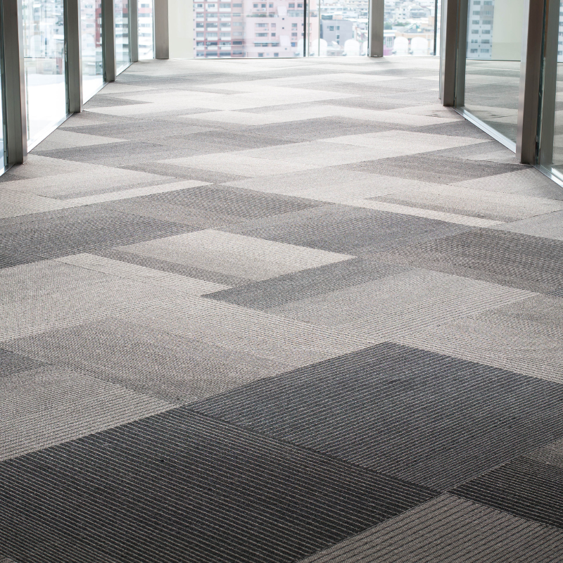 a carpeted floor in an office with a geometric pattern