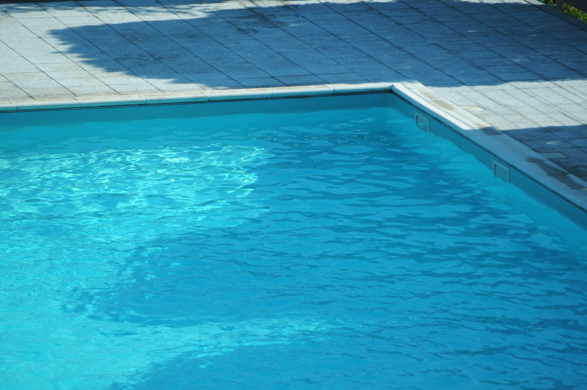 Automatic pool cleaner in action, showcasing a swimming pool contractor ensuring perfect services. Automatic pool cleaner in action, showcasing a swimming pool contractor ensuring perfect services.