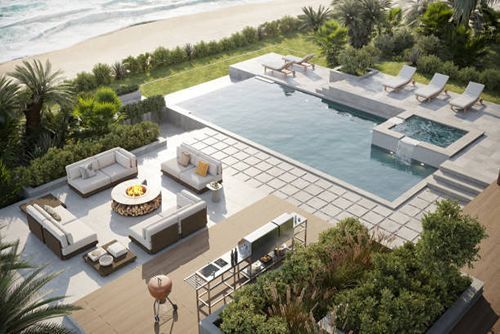 An aerial view of a patio with a swimming pool and a fire pit.