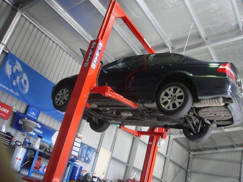 Car lifted on hydraulics