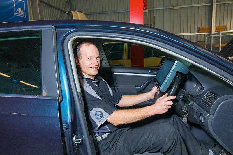 Mechanic sitting in a car