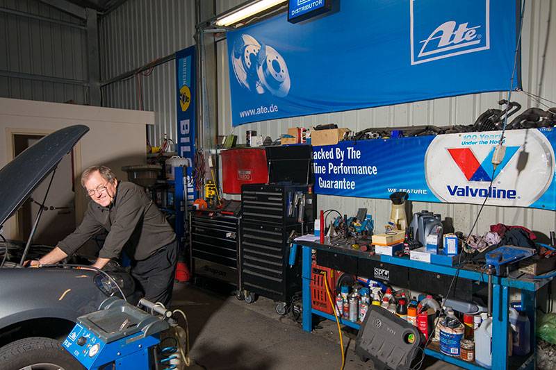 Man repairing a car