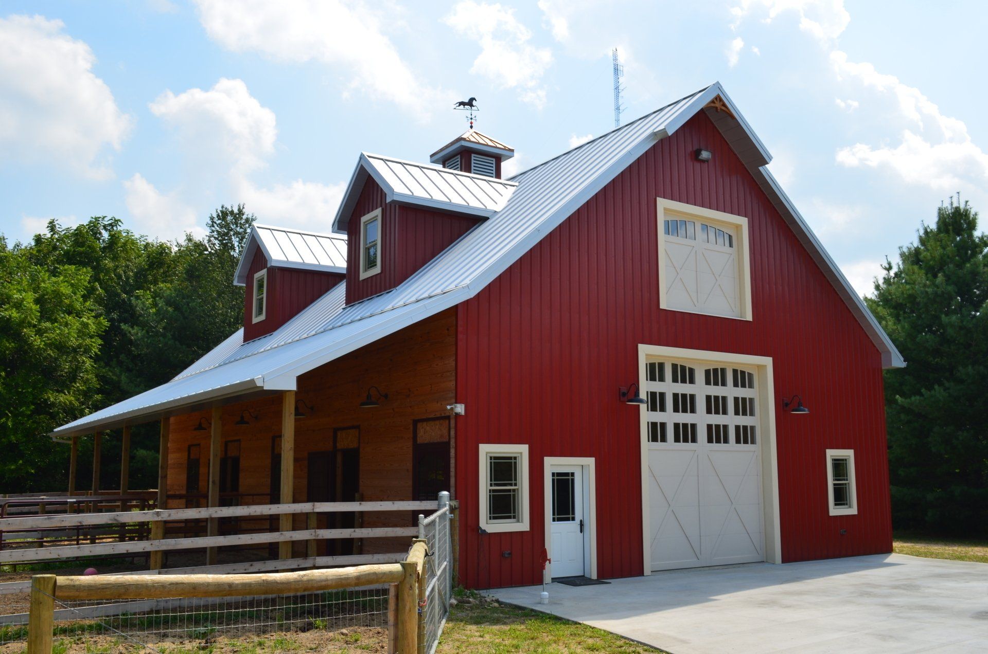 A large red barn with a white garage door