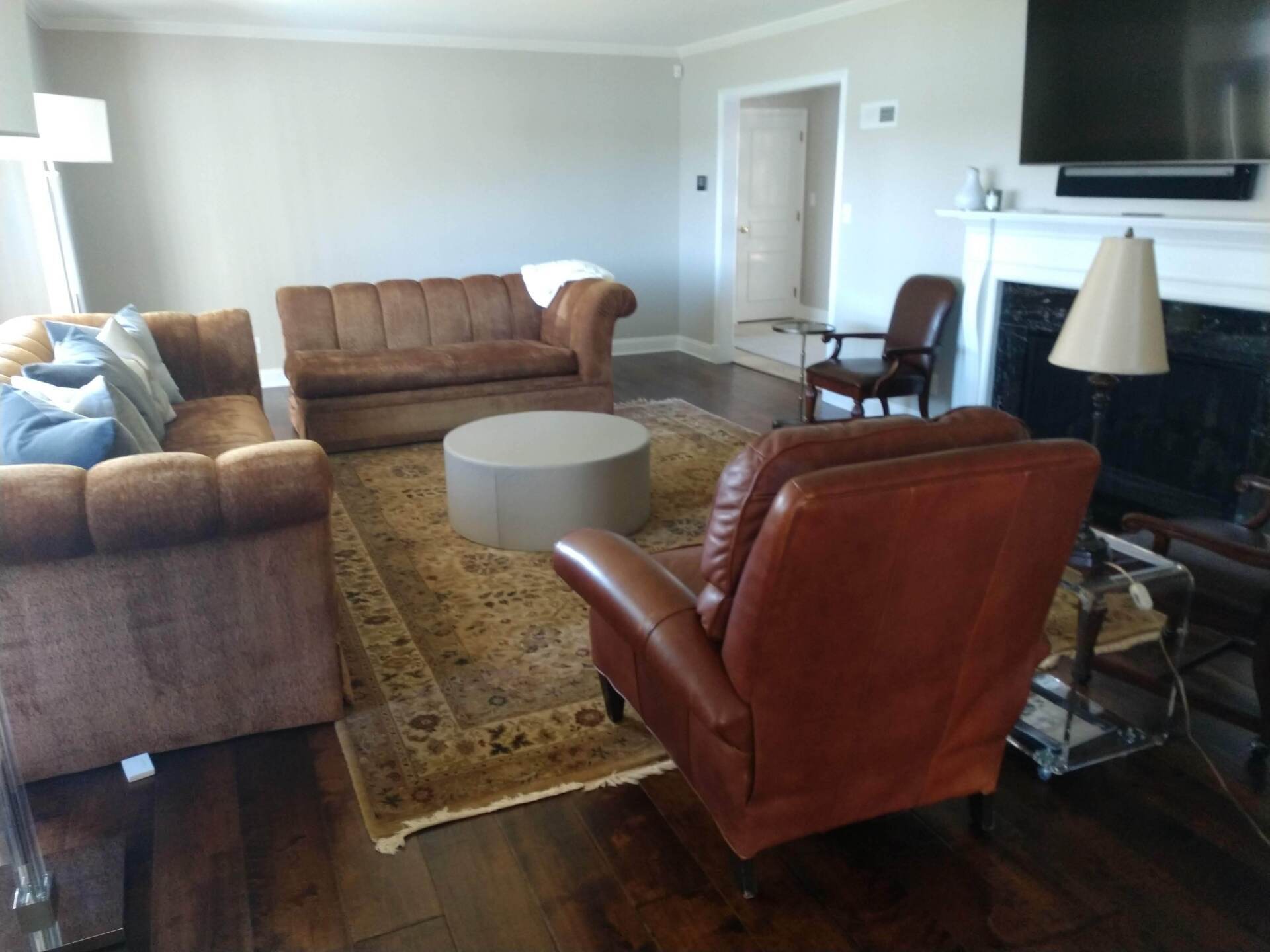 A living room filled with furniture and a fireplace