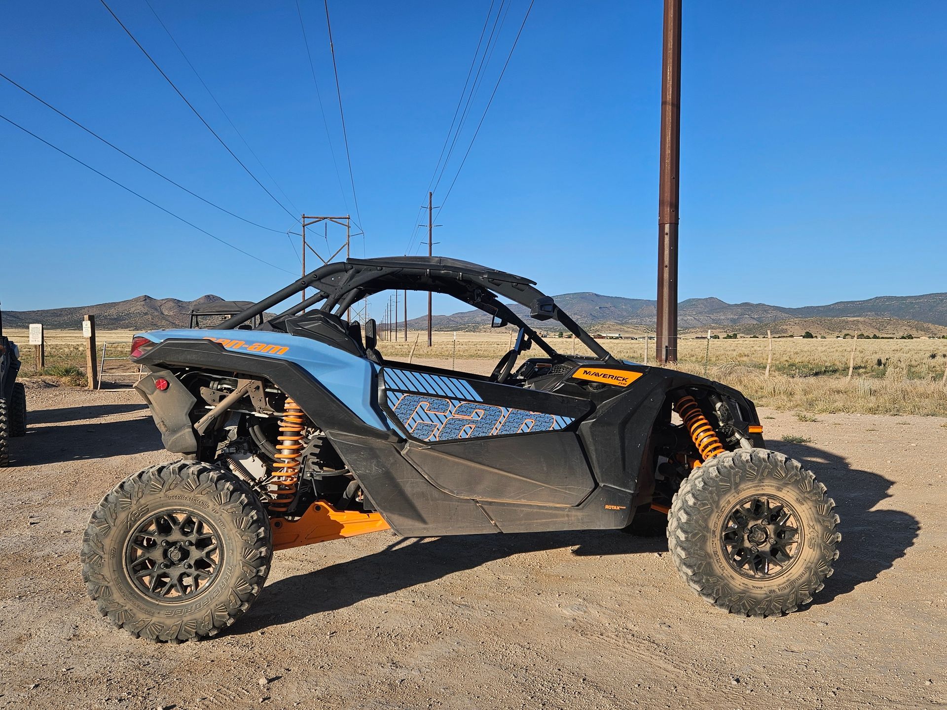 A group of atvs are parked in a parking lot.