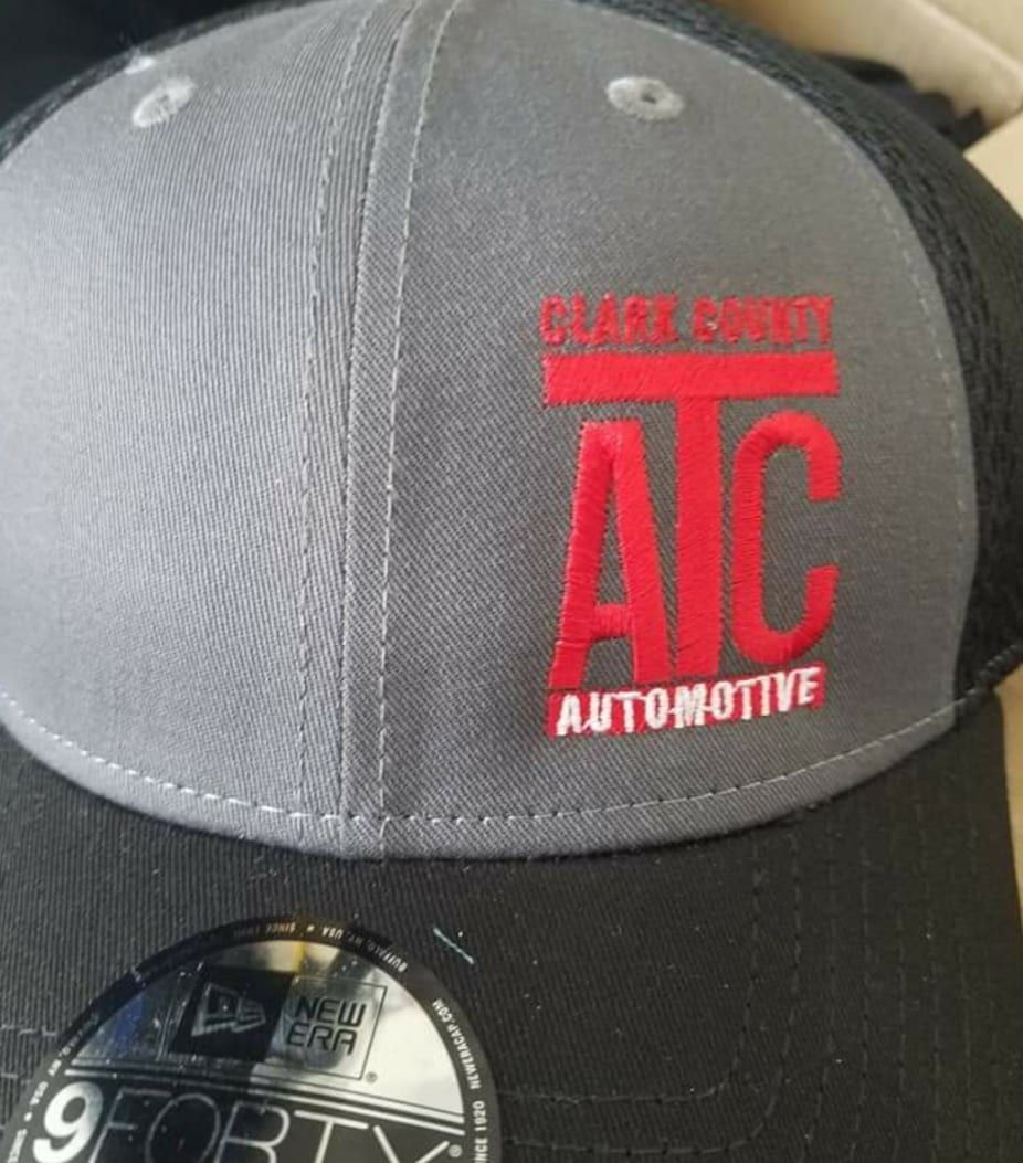 A baseball cap with the word aic on it